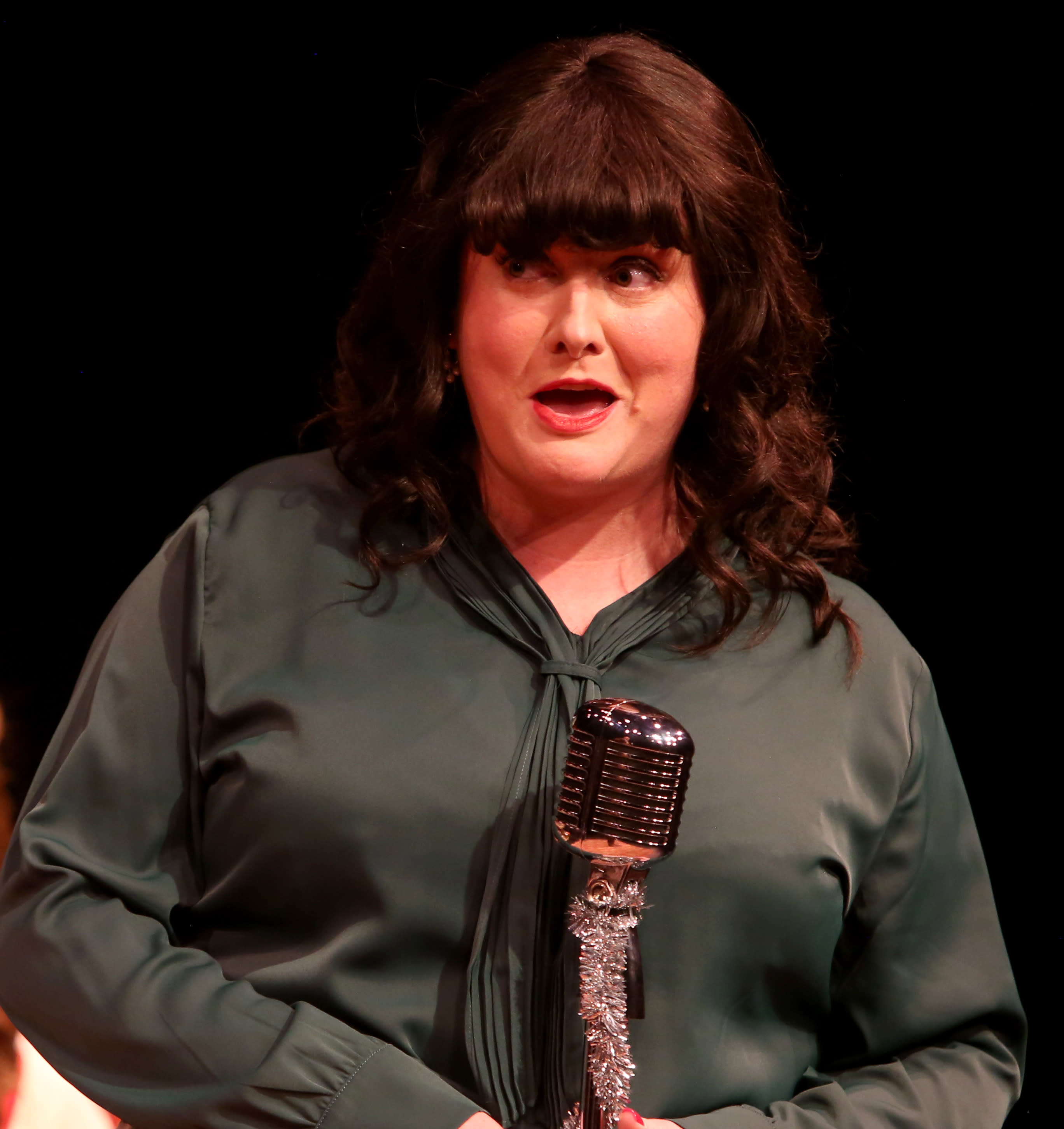 actor at a microphone