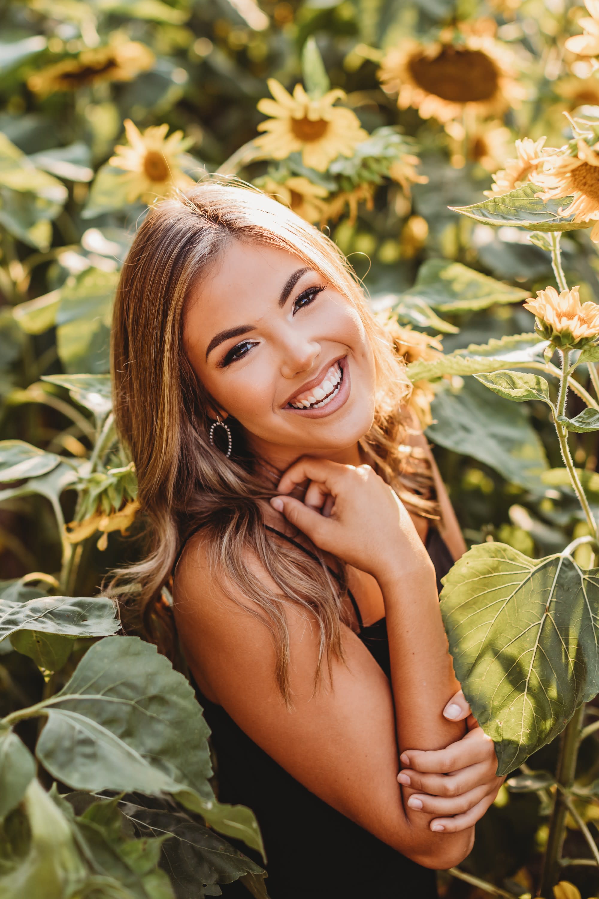 senior girl sunflower field