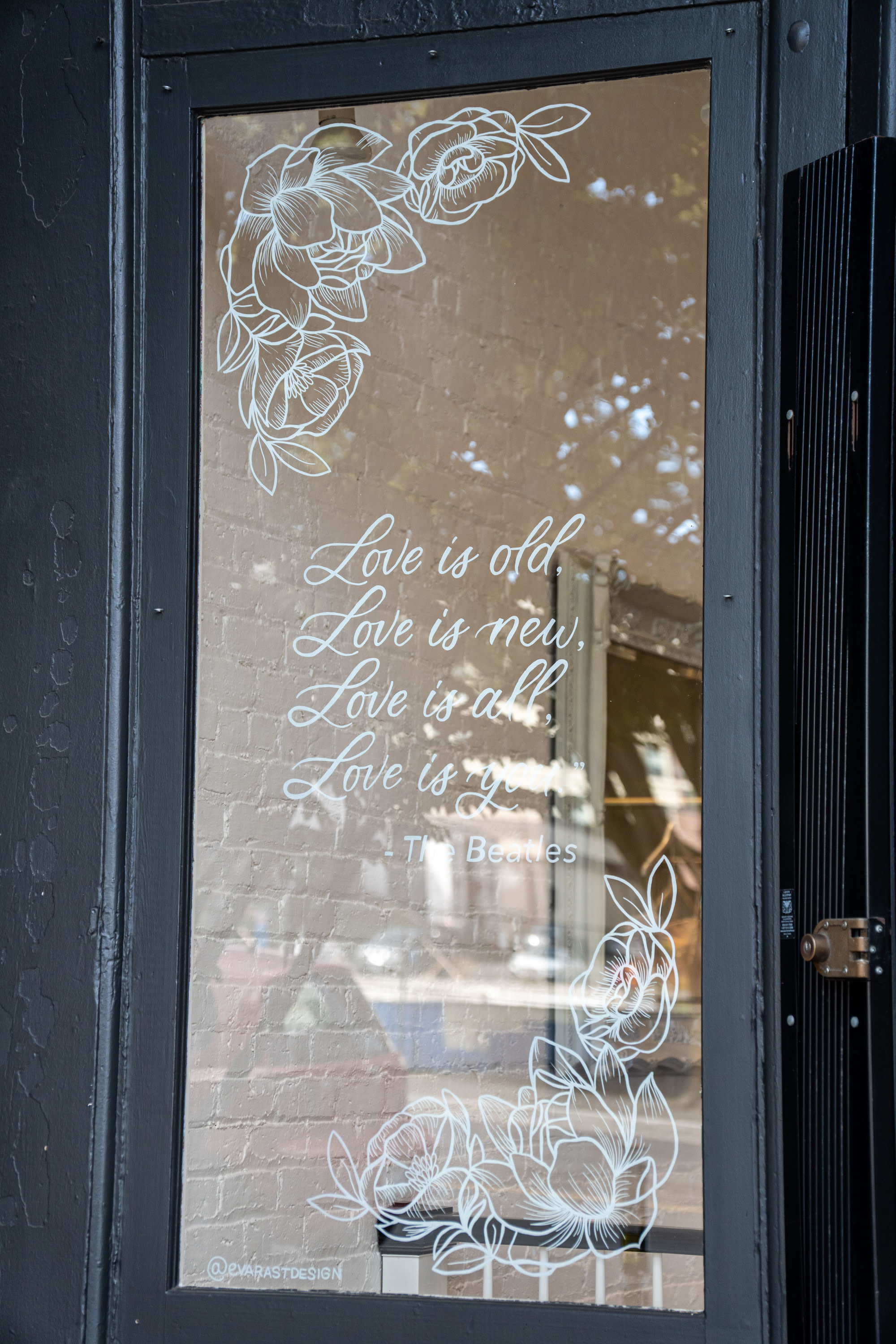 Hand-painted flowers and calligraphy words on glass