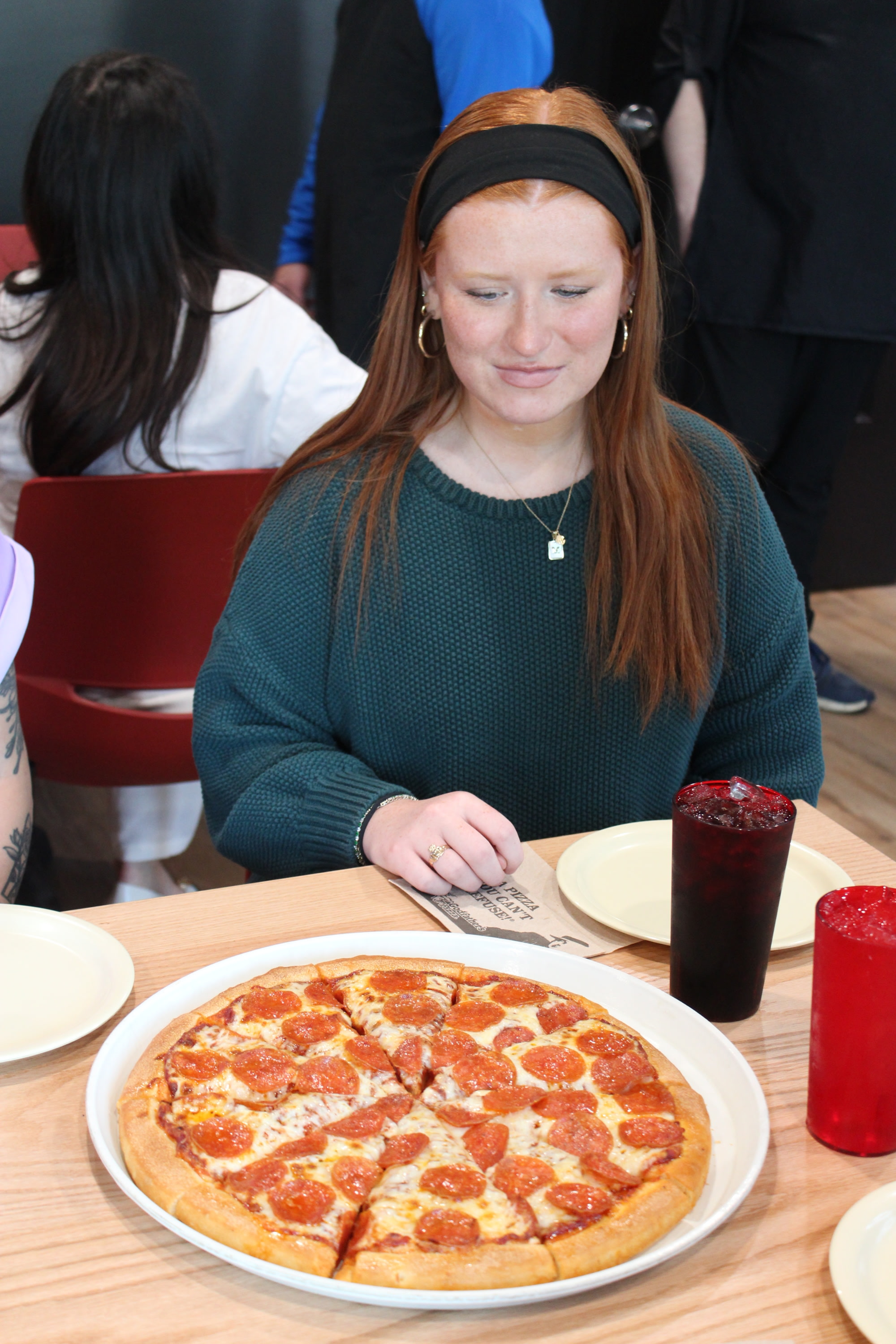 Co-workers enjoying their end of year party at Godfather's Pizza Party Room