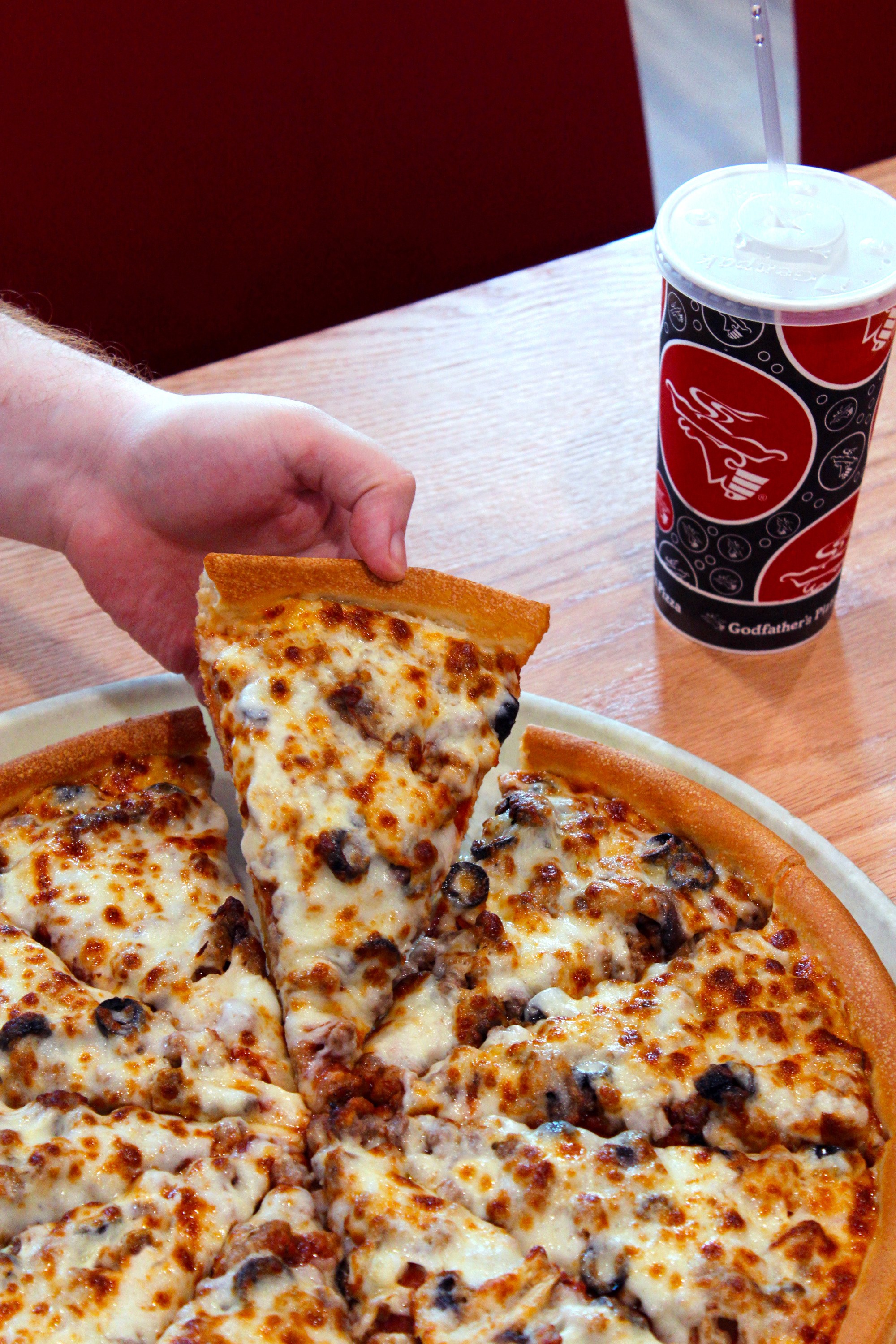 Co-workers enjoying their end of year party at Godfather's Pizza Party Room