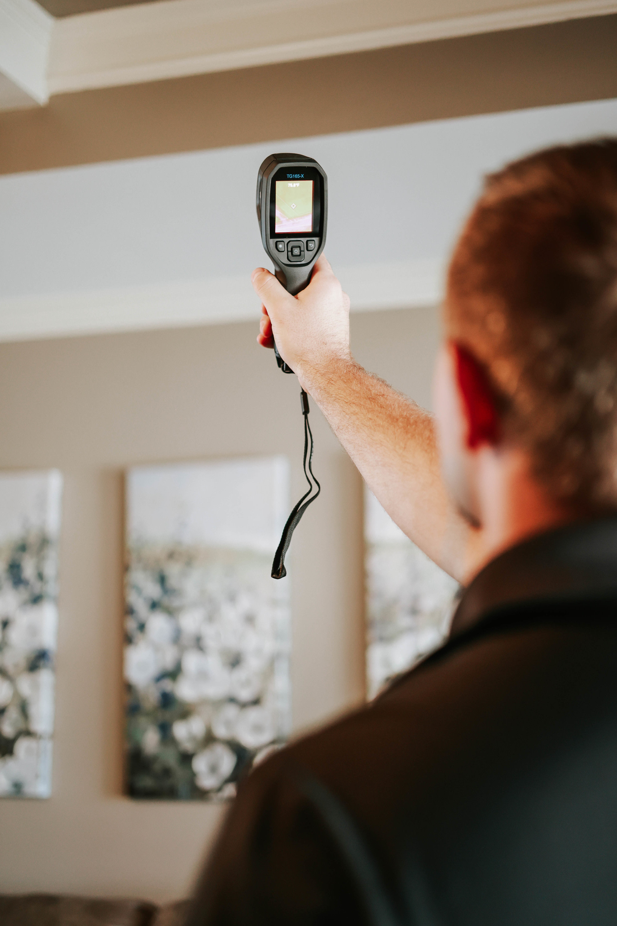 Palmer Inspections home inspector in Longview TX using infrared camera to detect hidden issues during a property inspection.
