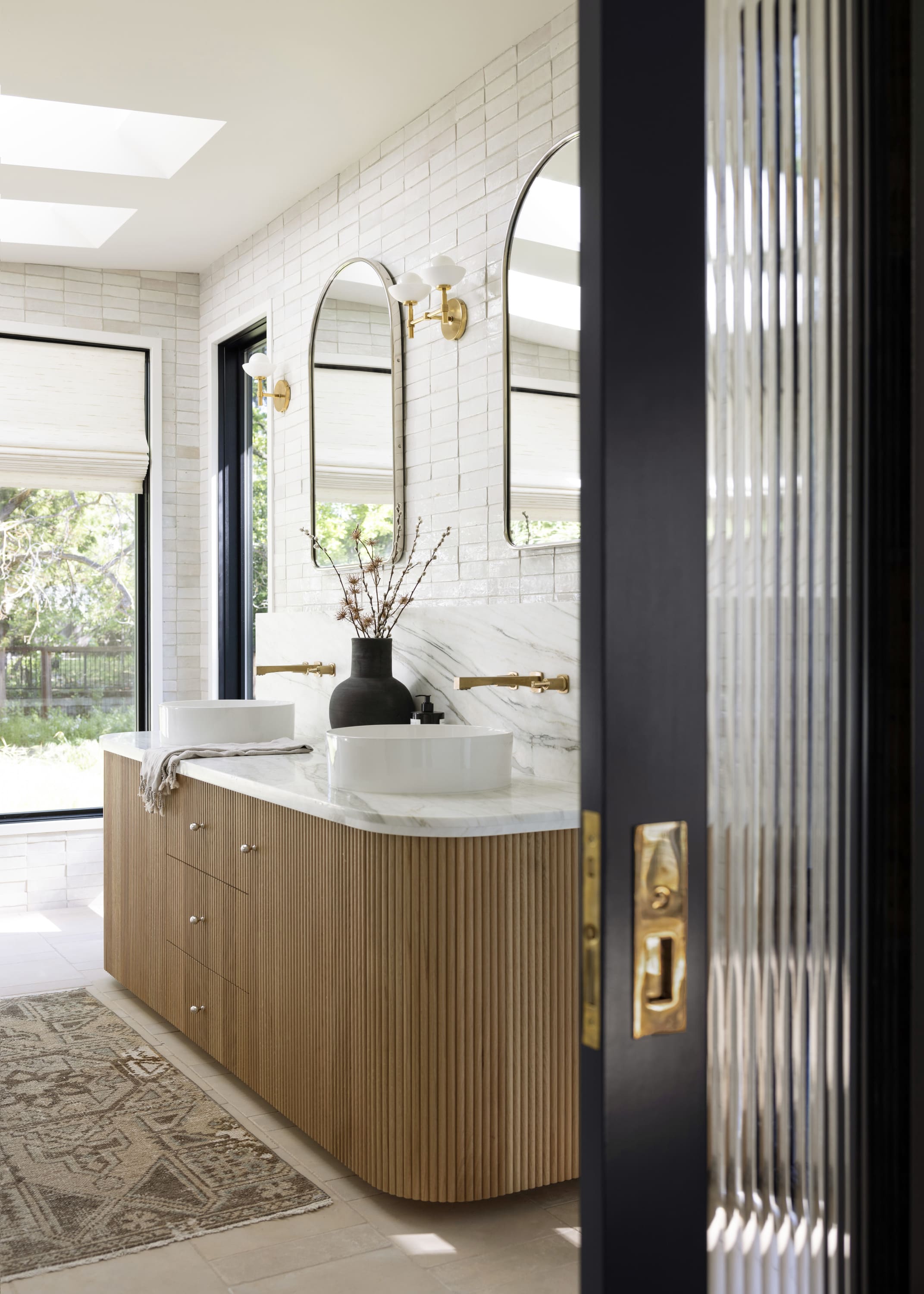 Bathroom remodel with handmade tile, warm neutrals, and organic modern fixtures