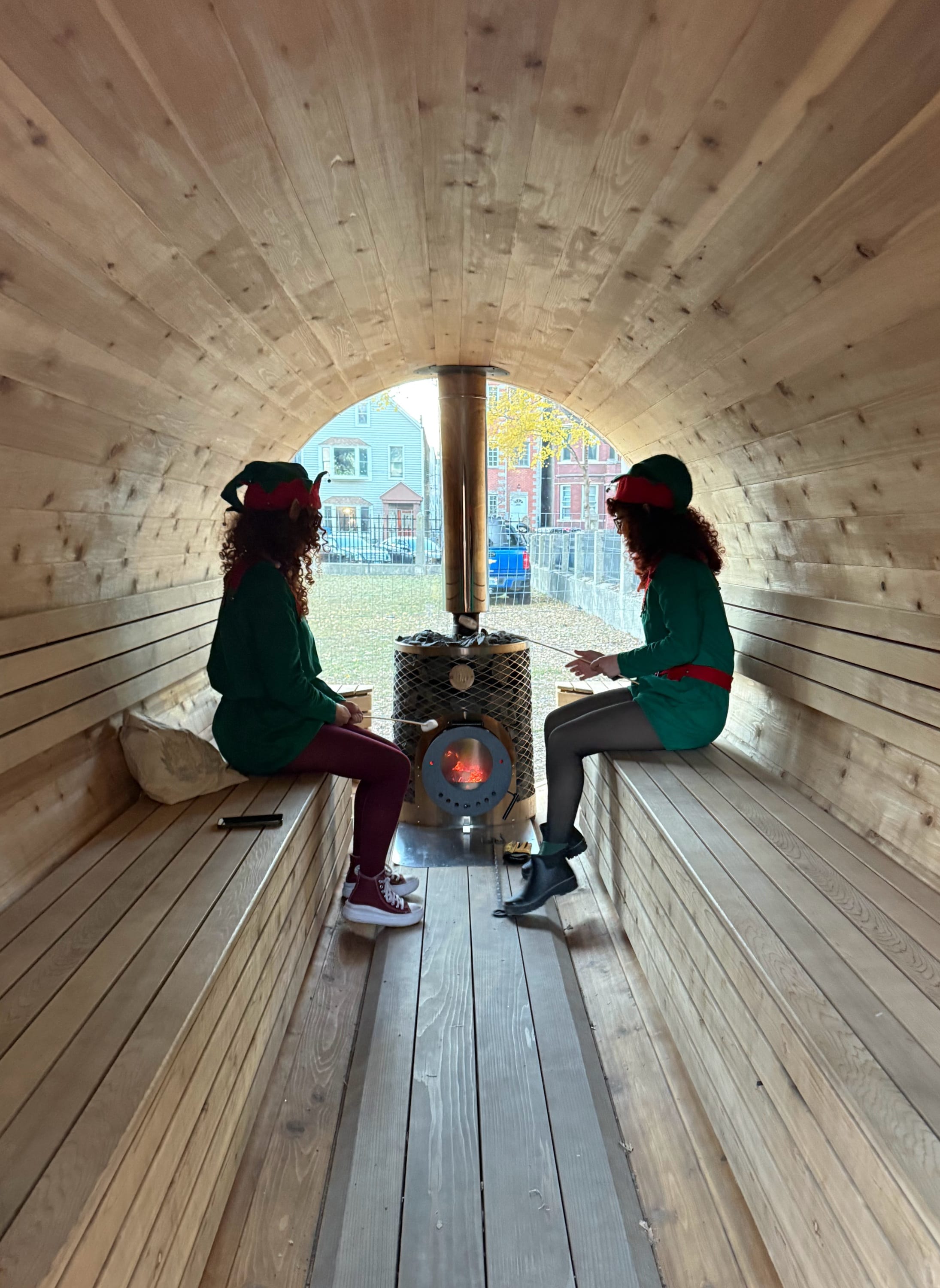 Winter Wonderland wood-fired sauna with elves roasting marshmallows