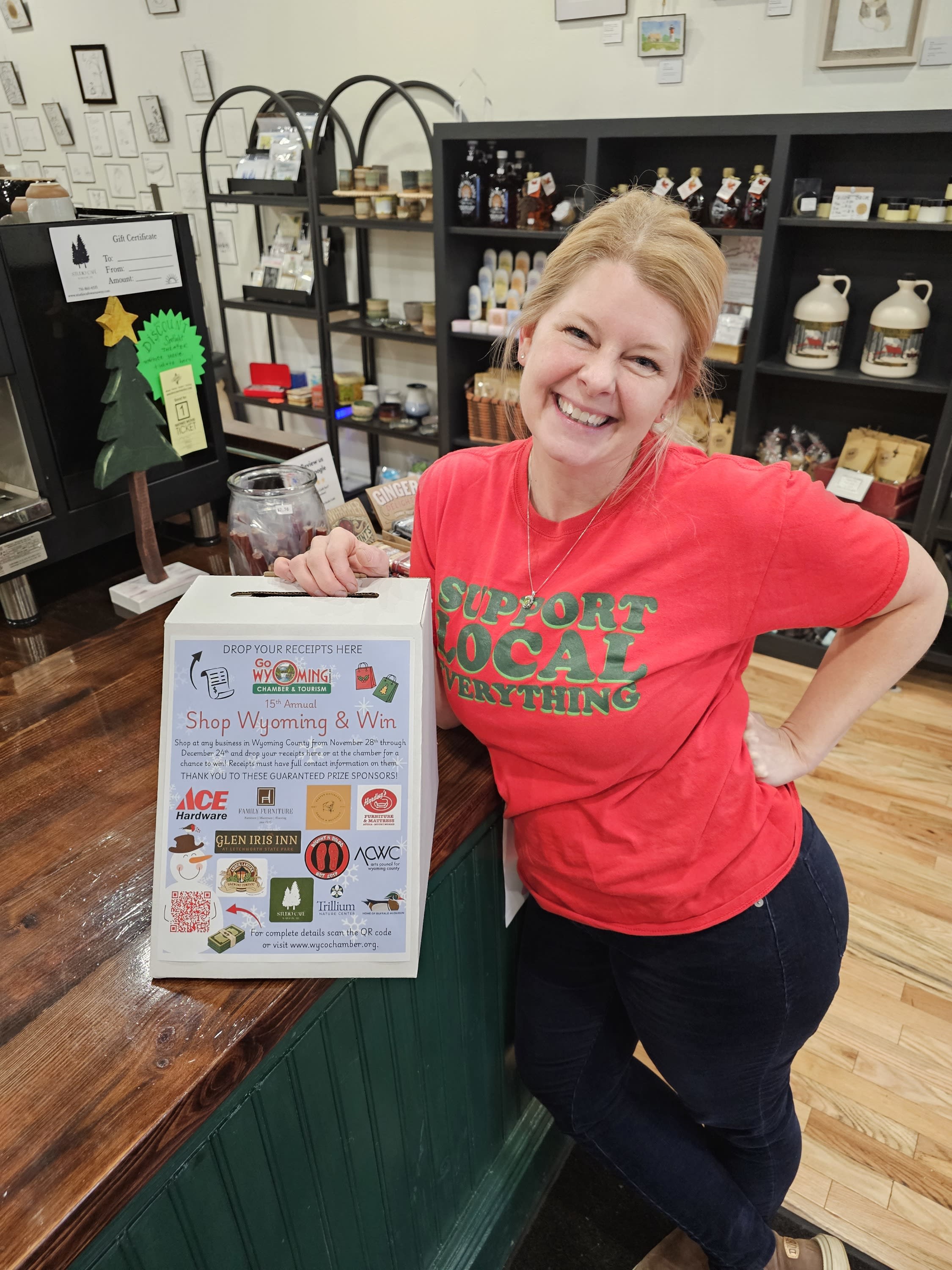 owner standing at counter with shop wyoming and win box