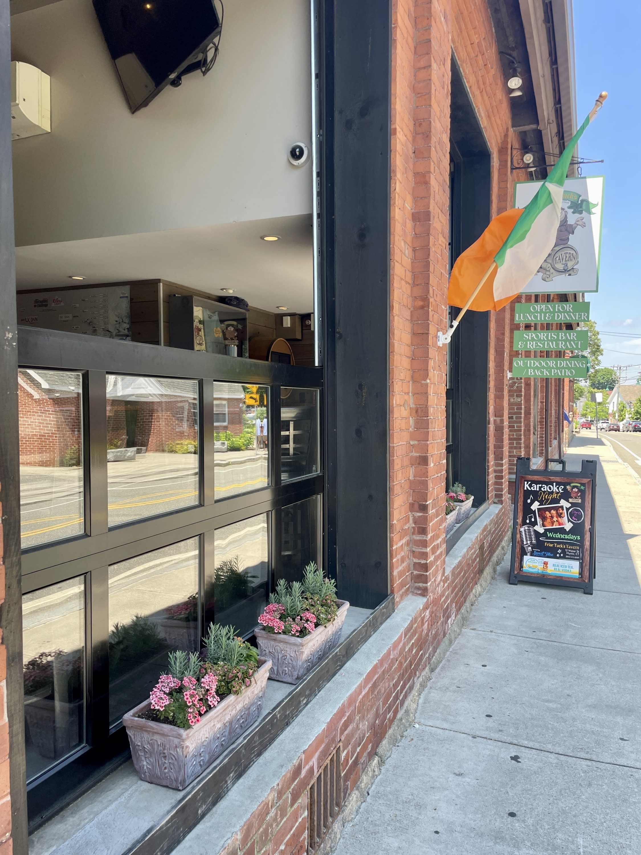 Large windows open to street at Friar Tuck's Tavern