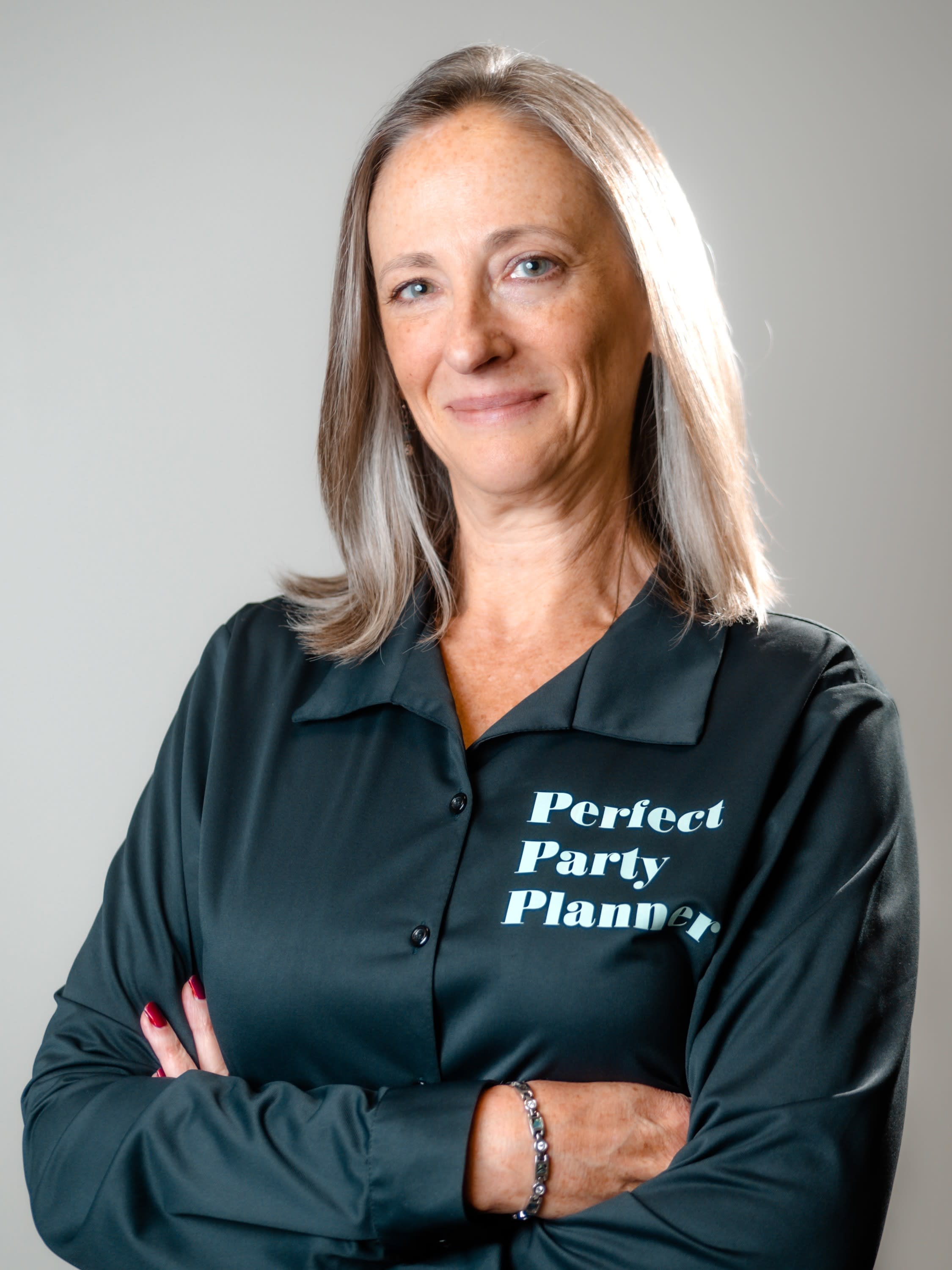 Owner Angelina Myler in black formal Perfect Party Planner blouse