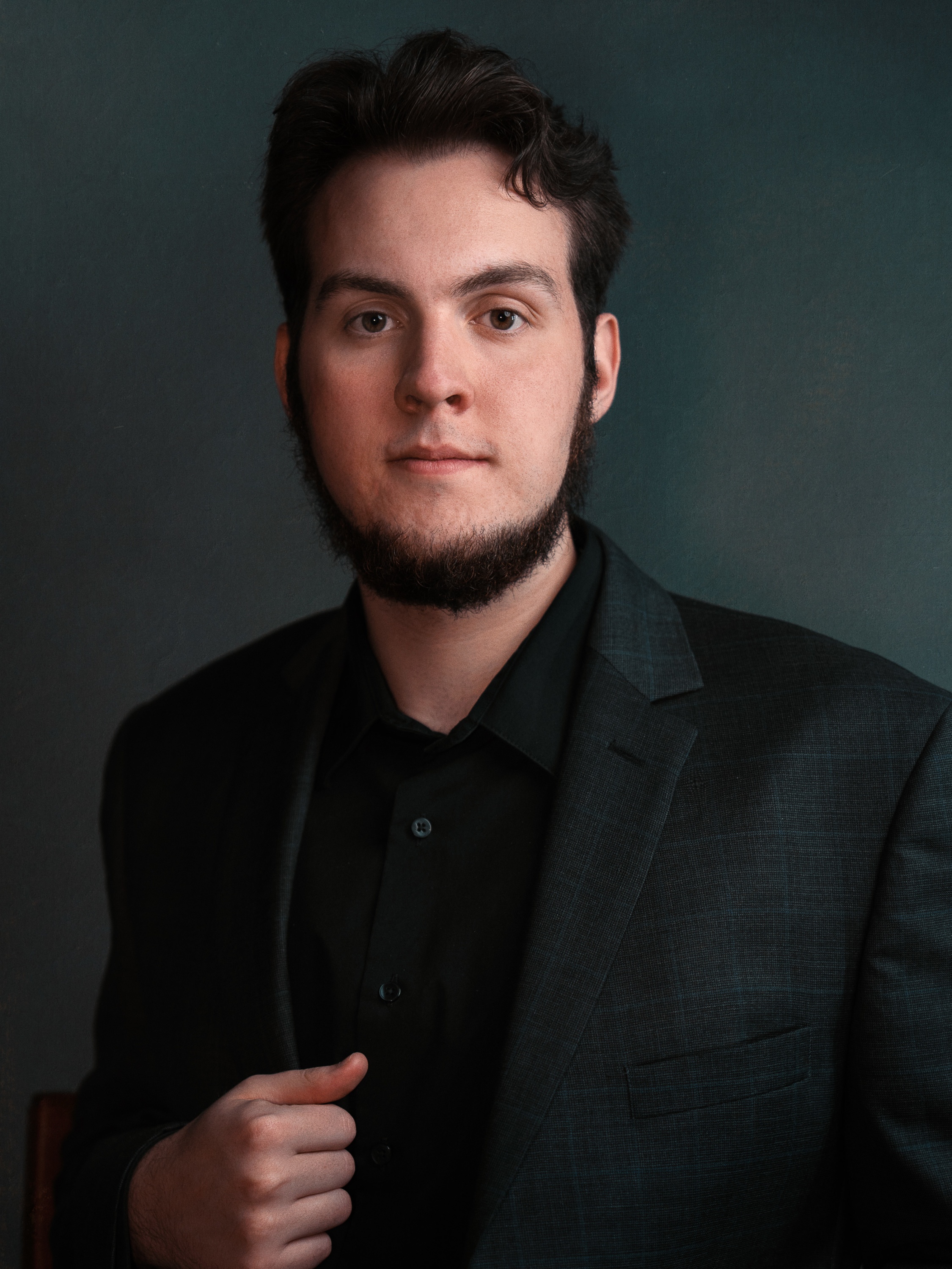 Professional Chief Investment Officer with a gray suit and a clean and professional background.