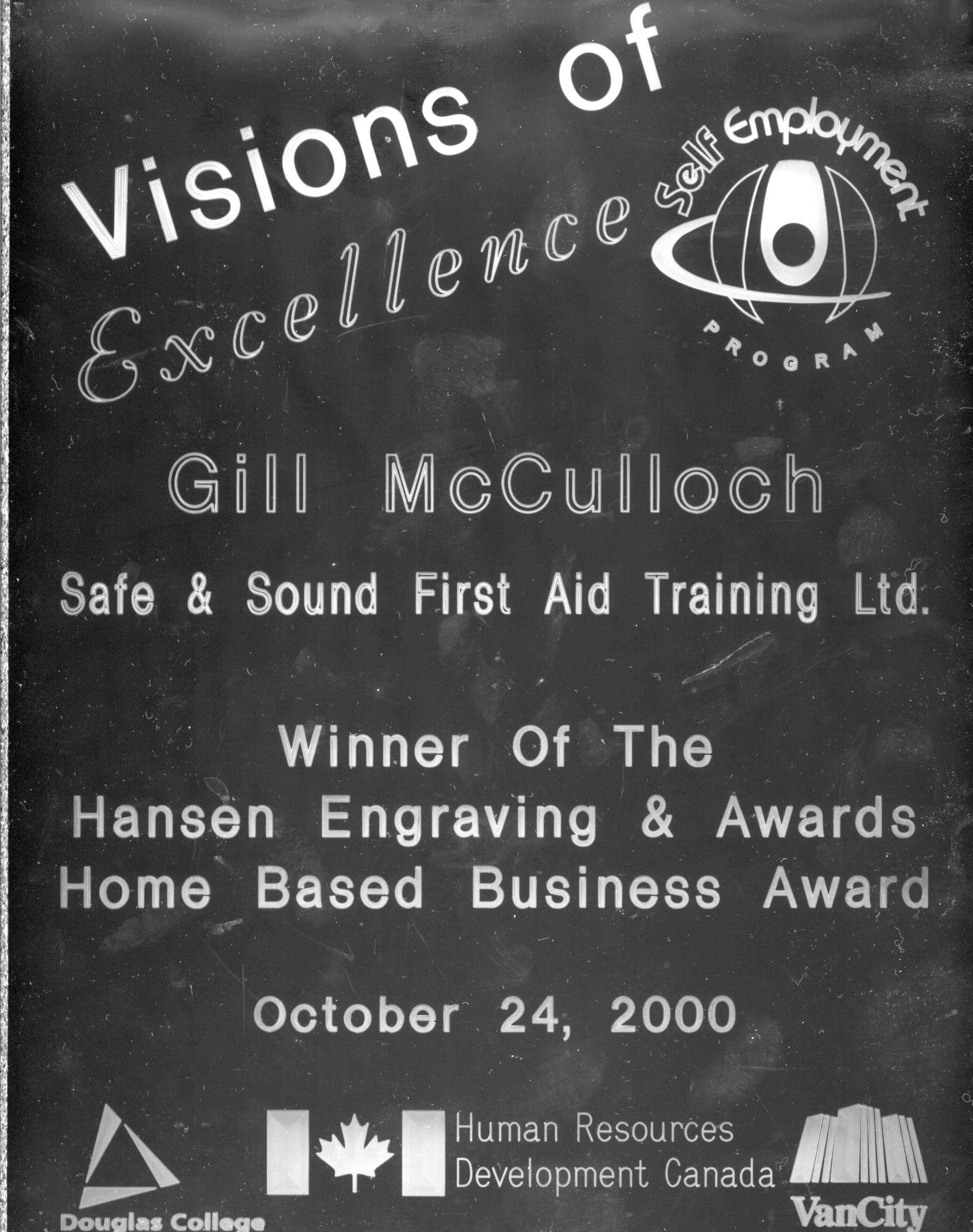 A plaque with the wording "Visions of Excellence, Self-Employment Program, Gill McCulloch, Safe + Sound First Aid Training.