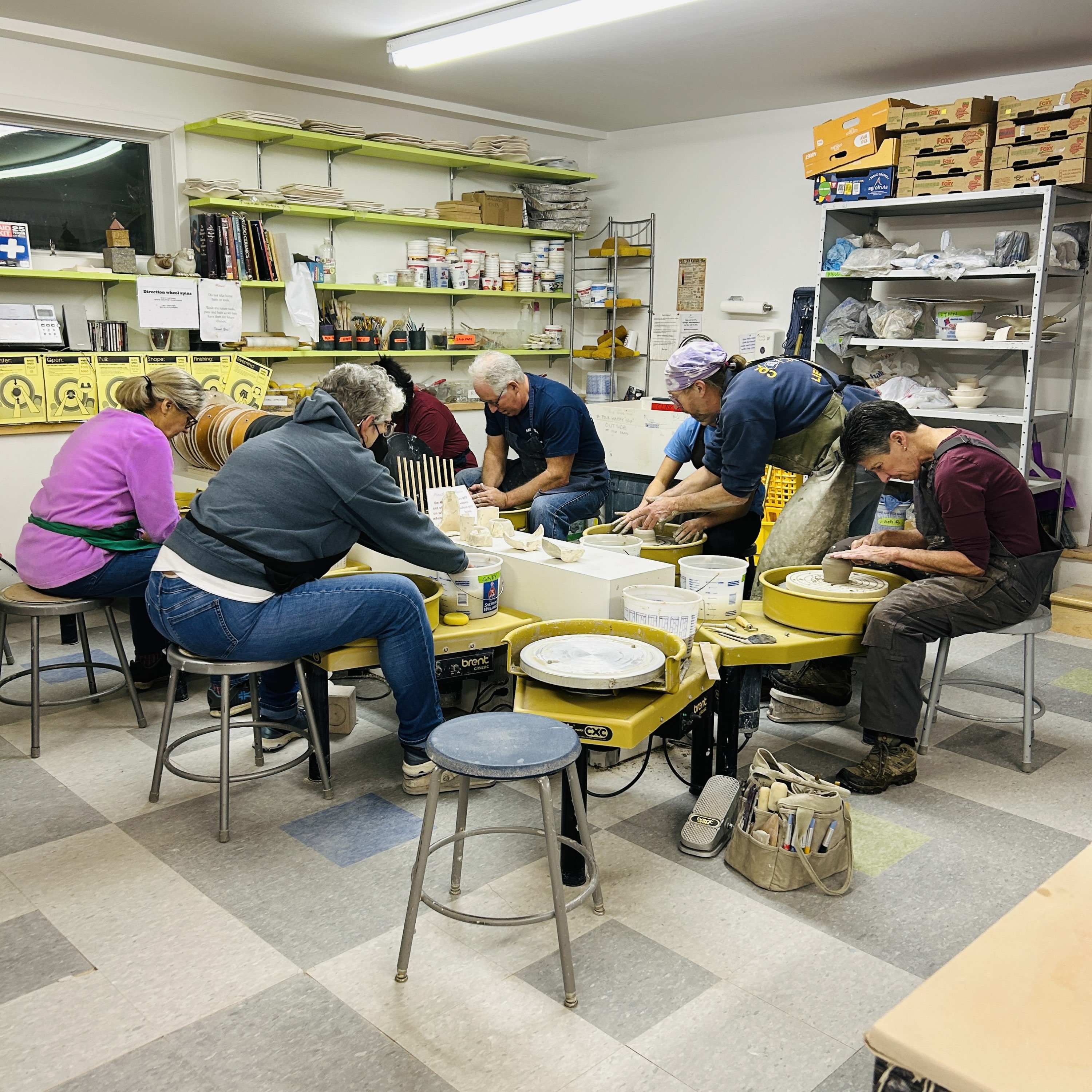 Students working on the pottery wheel