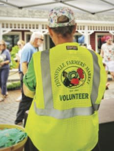 image of volunteer at the market