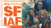 Picture of Loco Bloco at Carnival in San Francisco with the SF International Arts Festival logo in front
