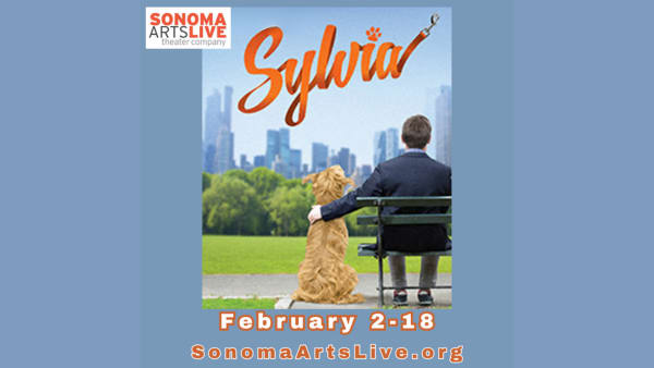 A man on a park bench with his dog