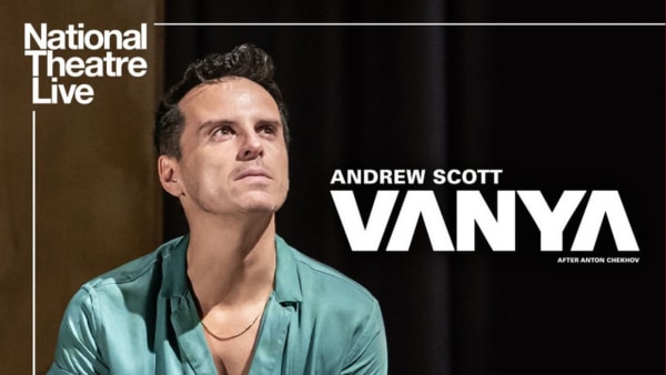 An image of a man in a green shirt staring towards the right side of the image.