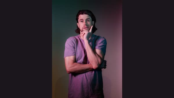 Dan Hoyle in a purple tee shirt