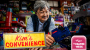 Playwright and star Ins Choi leans over a counter in a convenience store, holding a pricing gun, and smiling wryly at the cam