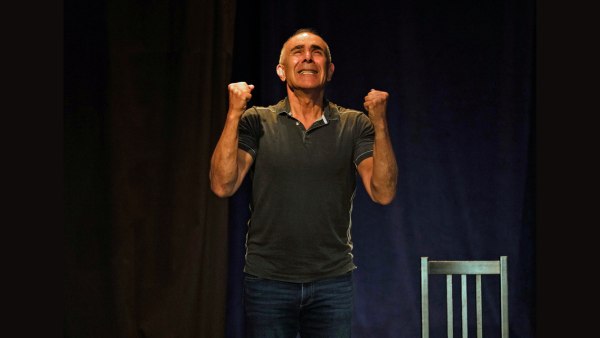 actor holds up his fists with emotion