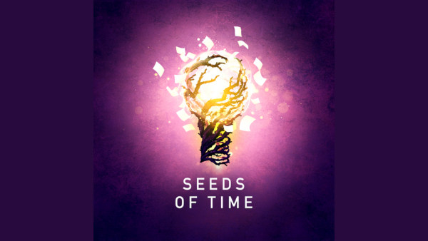 Ths dark purple image glows bright in the center, its shining orb sitting a-top a tall, twisting tree, with pages of script s