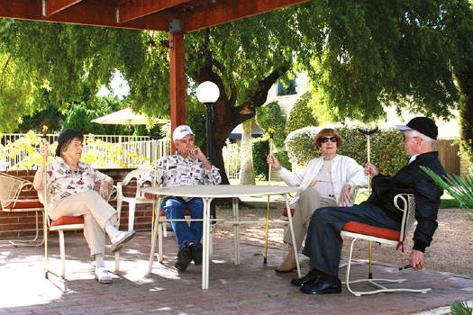 Photo of seniors chatting under a gazebo at Fellowship Square Tucson