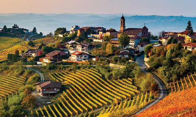 Rolling hills of Tuscany vineyards and idyllic countryside homes.