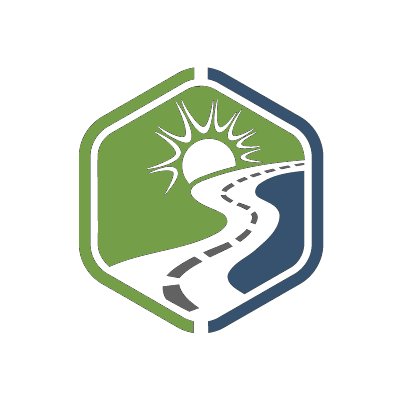 Logo for Pure Wander of road and sun in blue and green