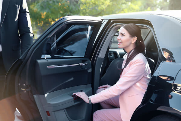 Private Driver Opening Door for Client