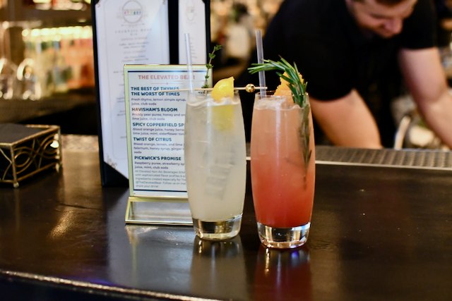 Two colorful ENABs sitting on a dark bar counter.