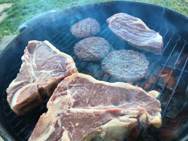 Steaks and burgers on grill