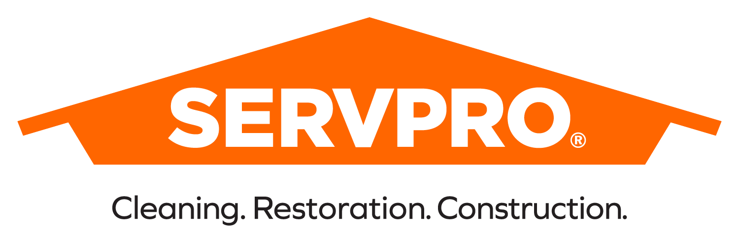 A logo for SERVPRO. An orange house shape contains the word "SERVPRO". Below it reads "Cleaning. Restoration. Construction."