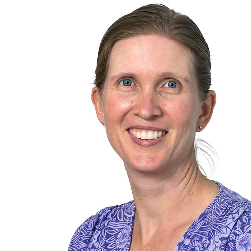 Female with light brown hair, blue eyes, purple shirt