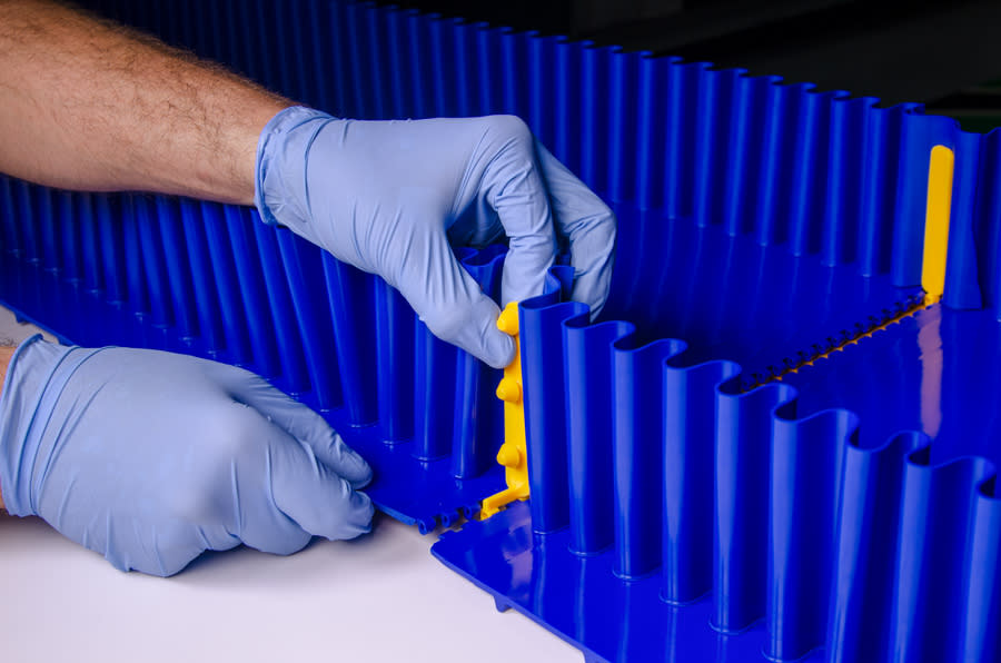 Person installing the Habaclip onto a belt sidewall.