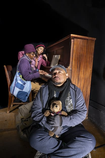 Brian Rivera, Velina Brown, Keiko Shimosato Carriero in winter clothes around a piano