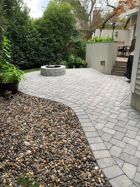 Paver patio installation with fire pit in Newton, MA