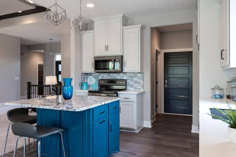 Bright open kitchen with a pop of blue