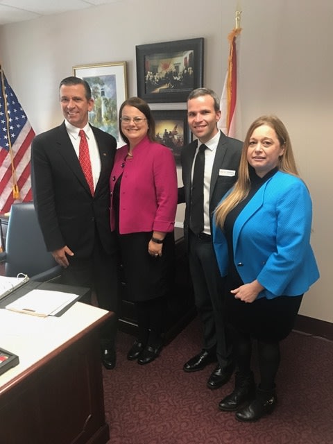 Home Care Day advocates with Representative Bob Rommel (left)