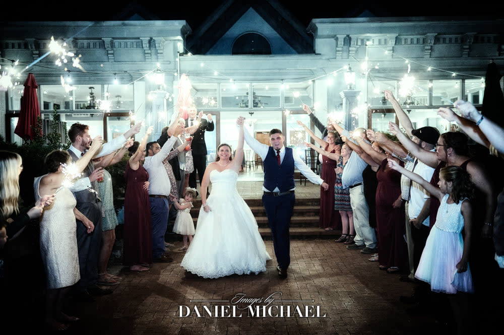 sparkler exit with bride and groom leaving reception