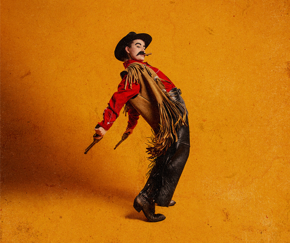 a woman dressed as a male cowboy throws his fringe back against an orange background