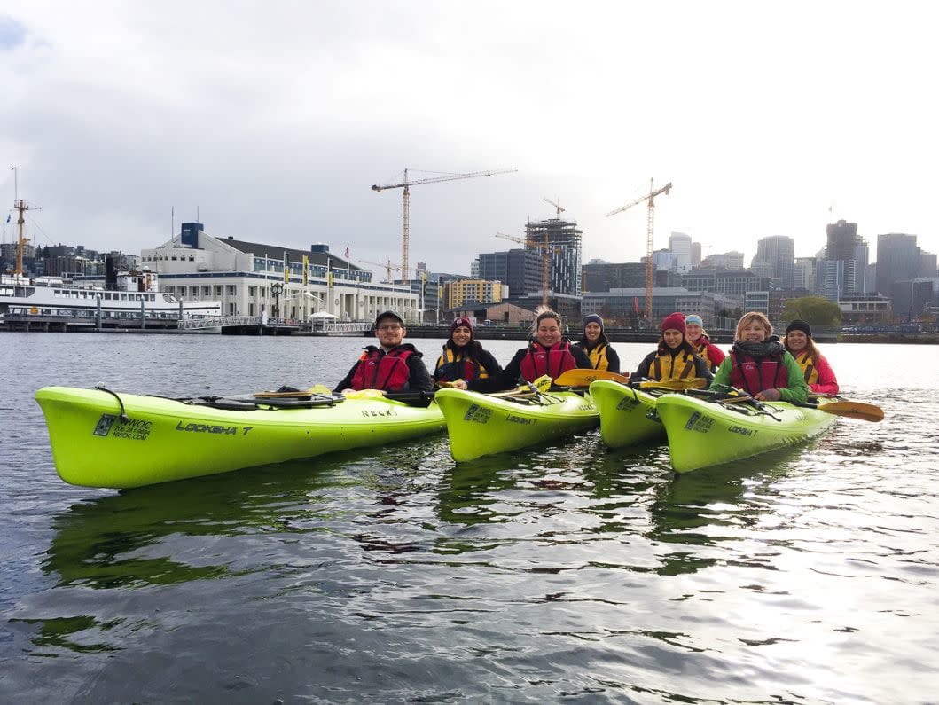 Four kayaks with volunteers in South Lake Union