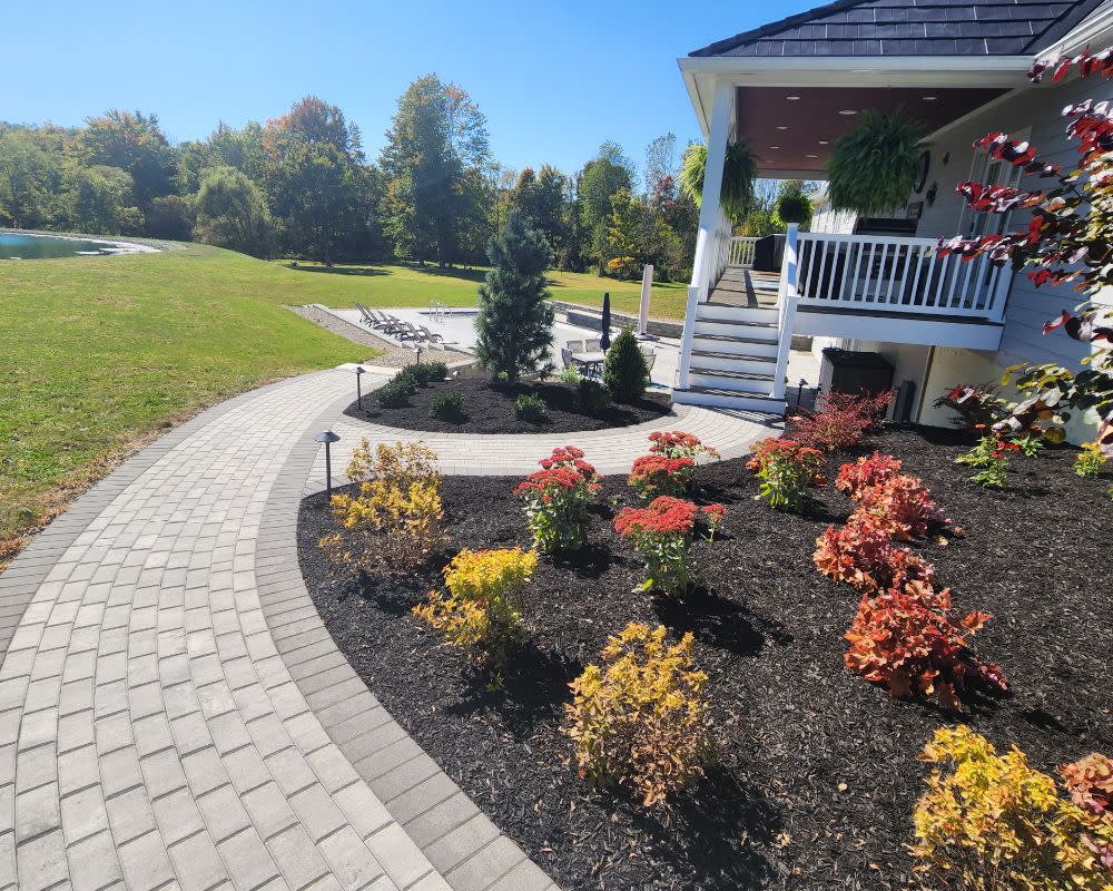Paver Walkway Winding Around Garden Beds
