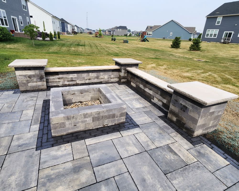 Backyard Paver Patio With Seating Wall And Outdoor Firepit.