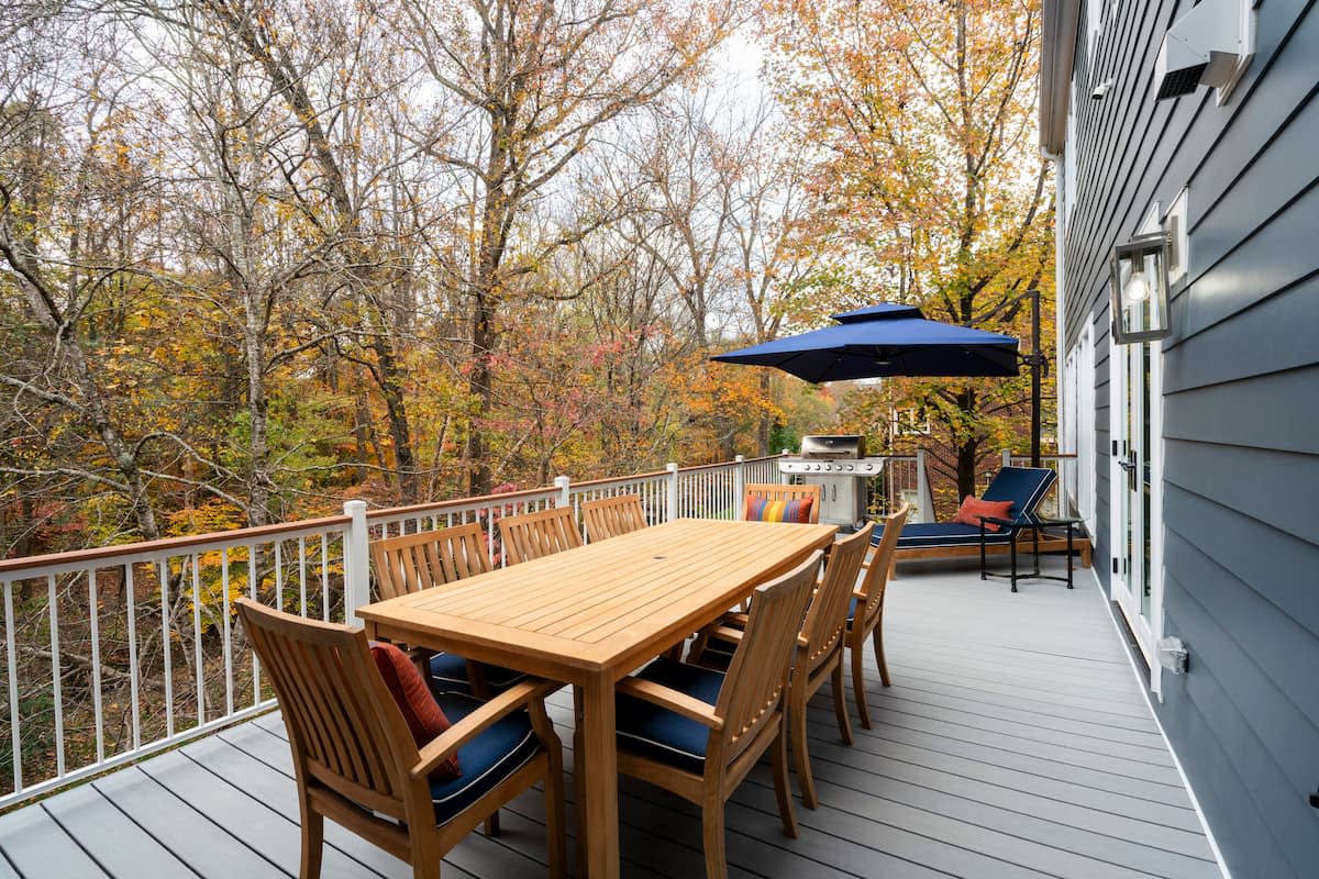 Trex deck with composite handrails for worry-free outdoor living in Charlotte, NC by Distinctive Design + Build + Remodel.