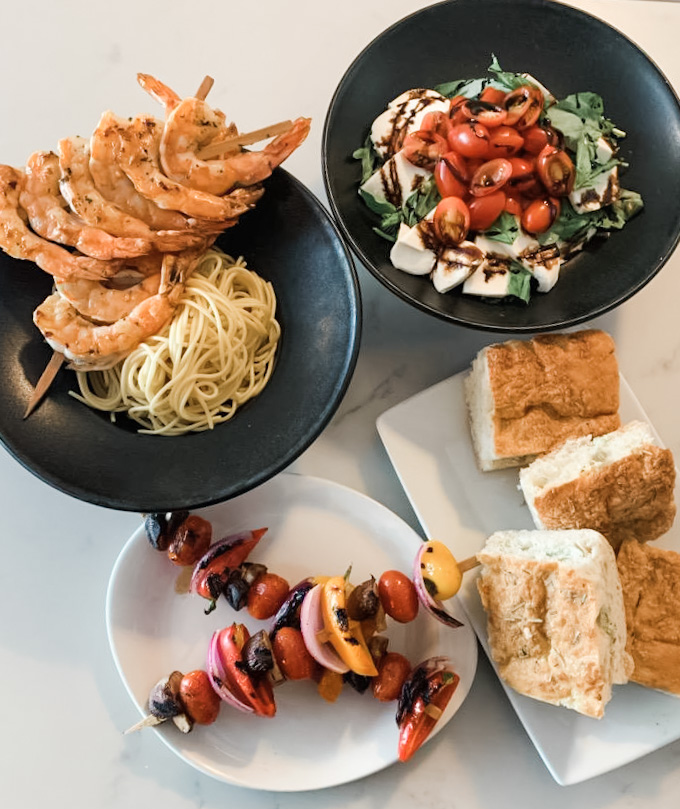 Shrimp Scampi, caprese salad topped with balsamic reduction, fresh linguini pasta, roasted tomato & broccolini.