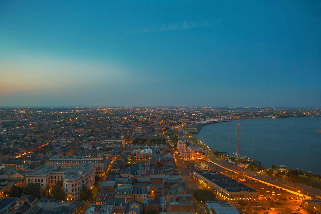 Photo of skyline view from New Orleans Marriott at night, includes buildings & Mississippi River