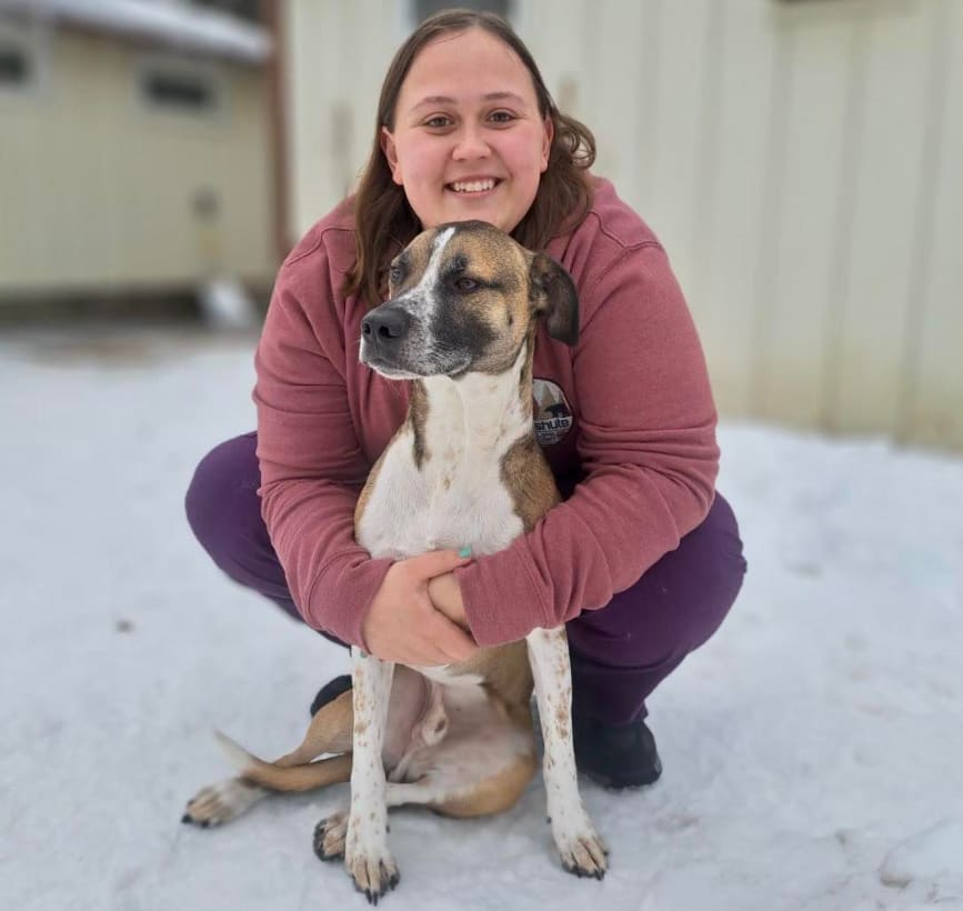 Kiley cuddles Casspir outside.