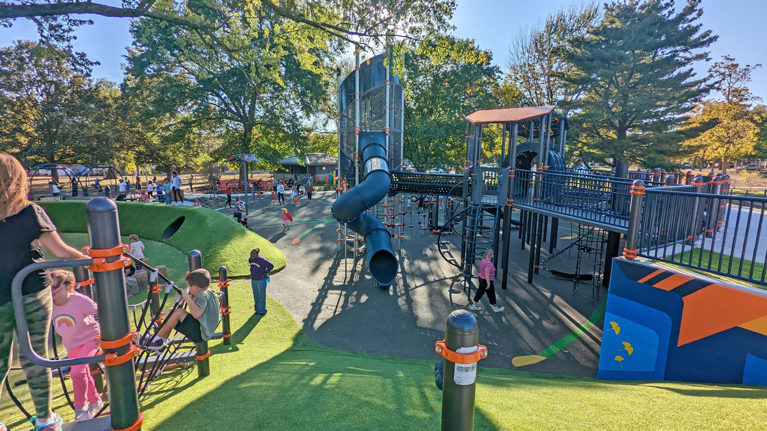 children play on a playground at Strang Park in Overland Park