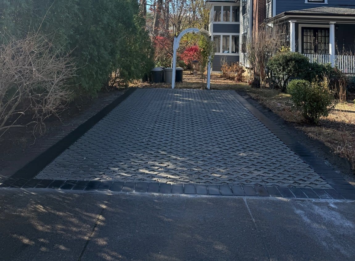 Permeable paver driveway installation in Newton, MA for drainage and stormwater control — Goodwood General Construction.