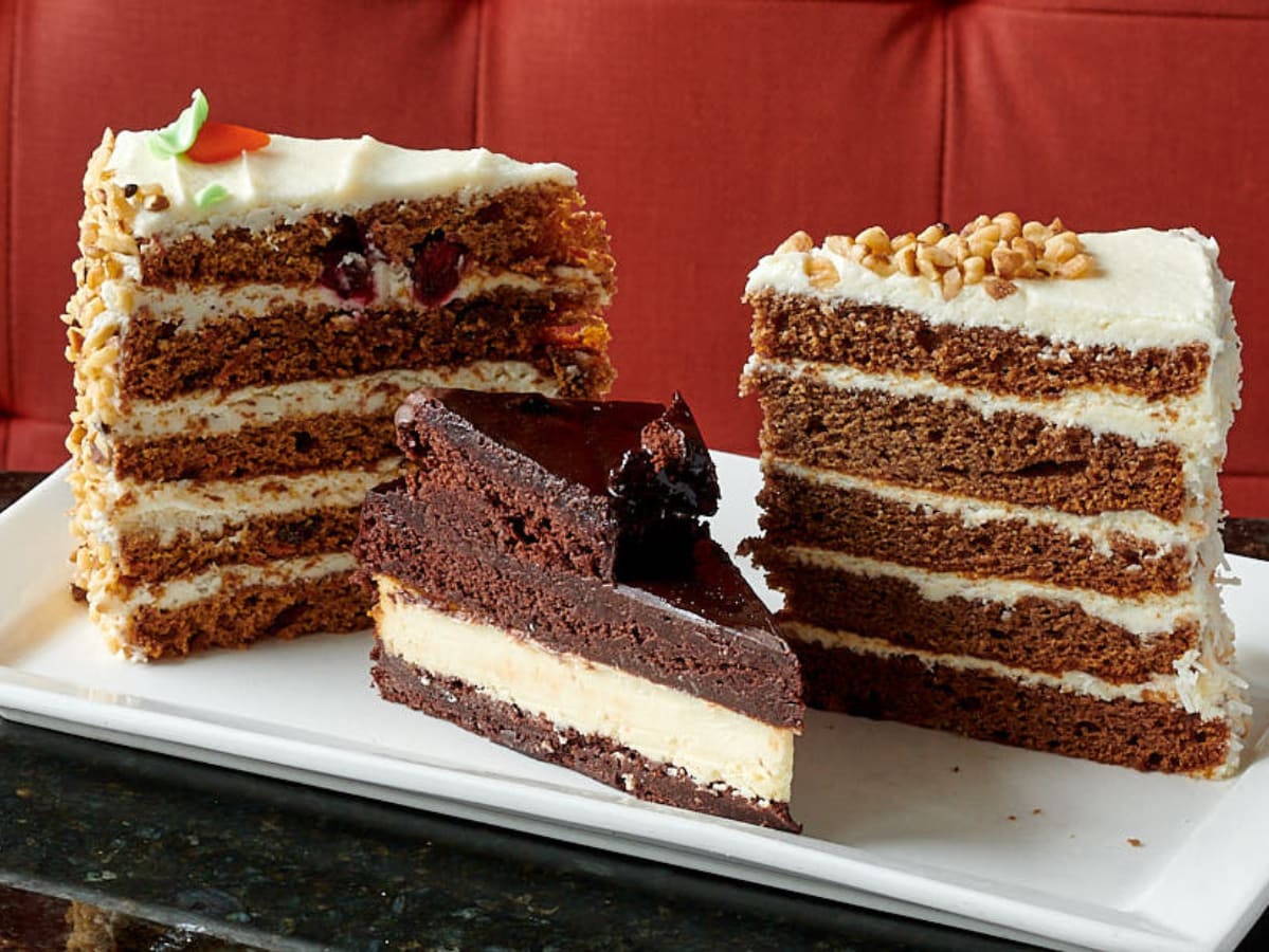 Hummingbird Cake, Fudge Brownie Cheesecake, and Carrot Cake all signature cakes at Symposium Cafe Restaurant Georgetown