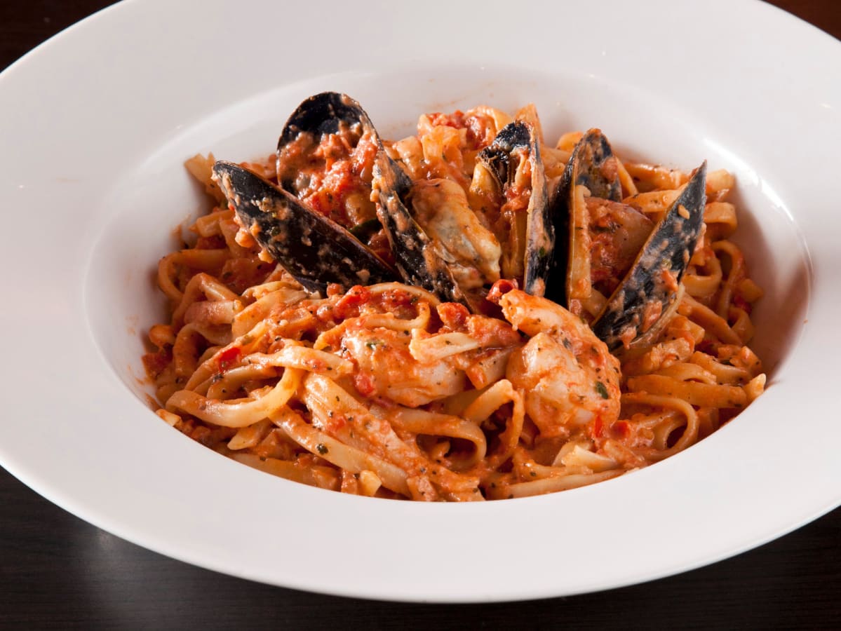 Seafood Pasta dinner with mussels and shrimp at Symposium Cafe Restaurant Georgetown