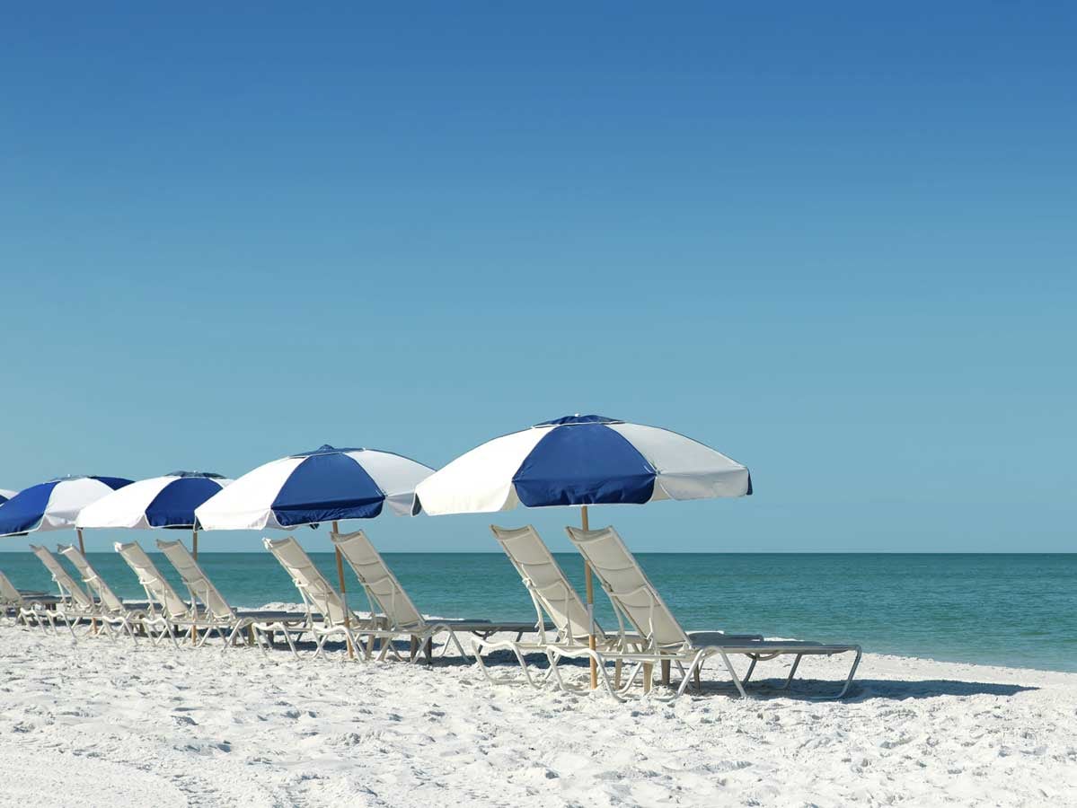 photo of umbrellas and chairs on the beach