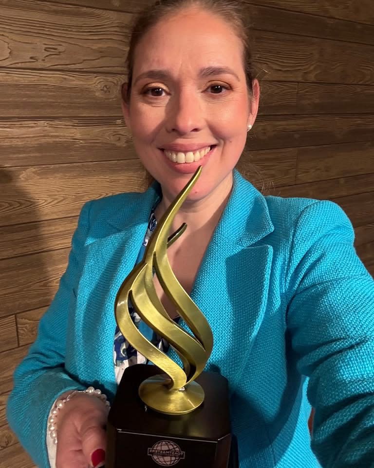 Maura Abad with First Place Trophy